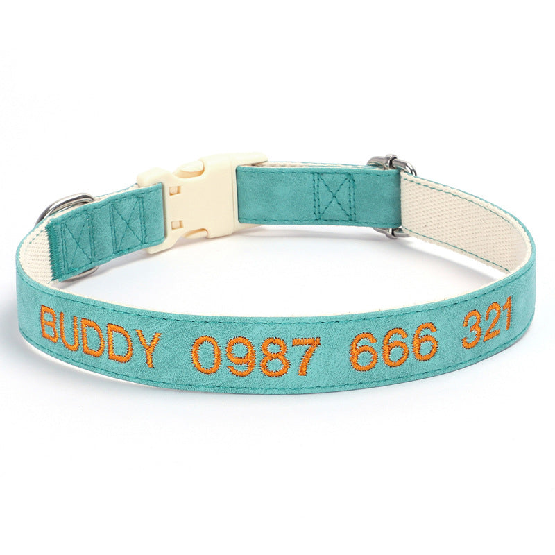 Teal dog collar with orange text on a white background