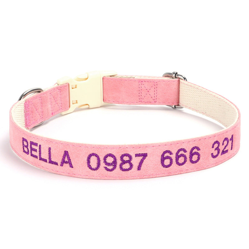 Pink dog collar with embroidered text on a white background