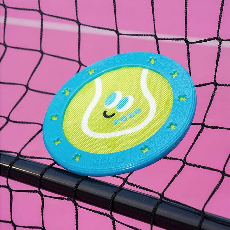 Toy disc with tennis ball design on a pink and black net background