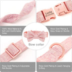 Pink dog collar with bow and rose gold hardware on a white background
