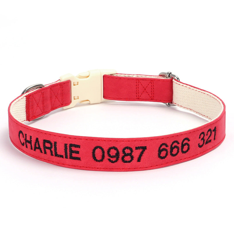 Red dog collar with black text on a white background