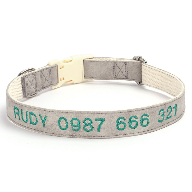 Dog collar with embroidered text on a white background