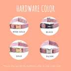 Dog collars with different hardware colors on a peach background