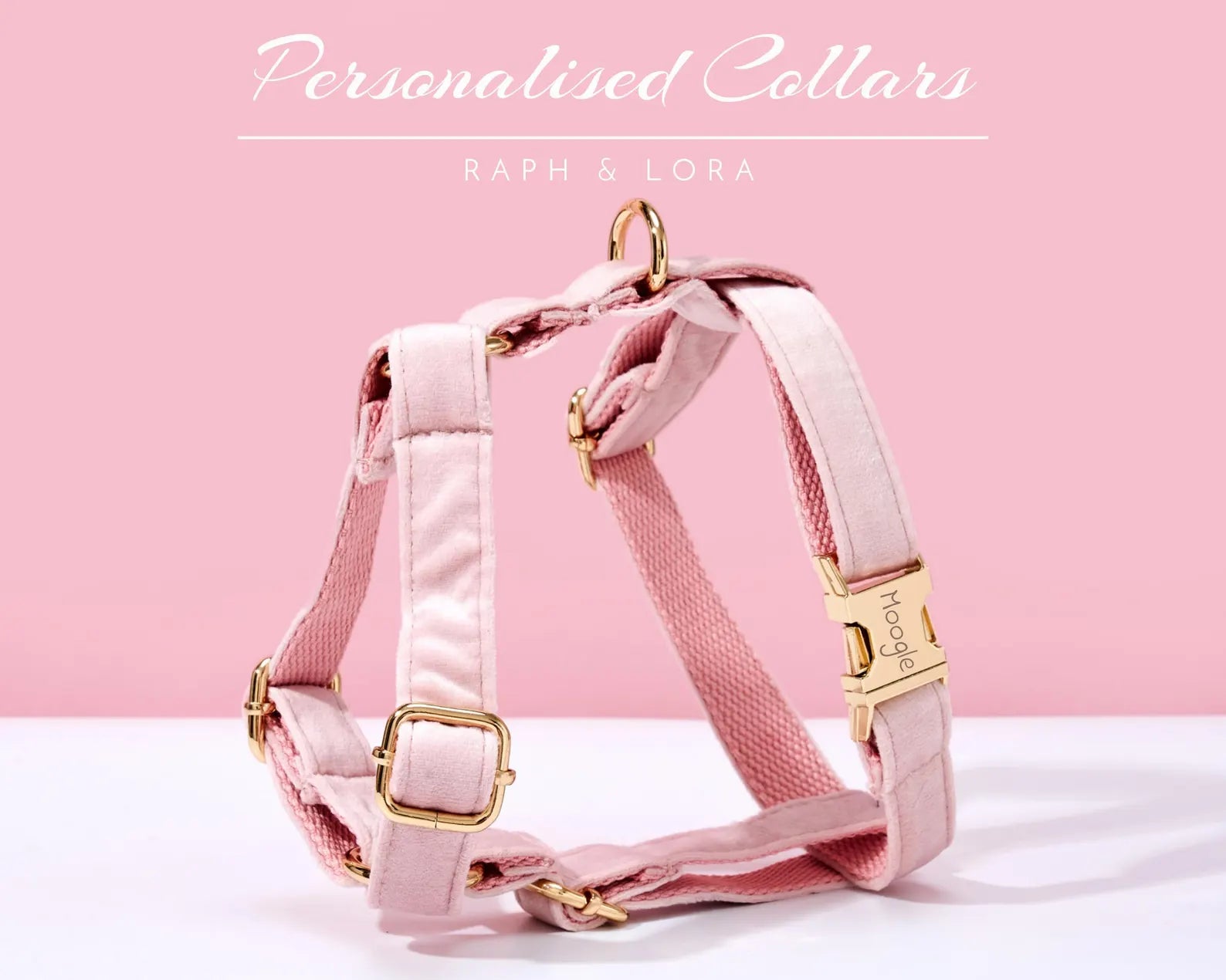 Pink dog harness with gold hardware on a pink background, featuring the brand 'Raph & Lora'.